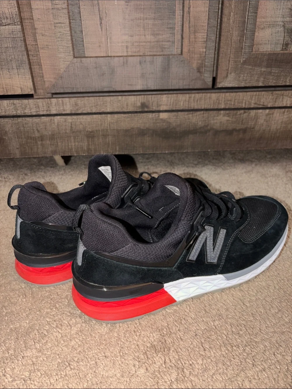 New Balance Men's Black Sneakers with Red Midsole Accents